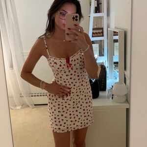 Red floral mini dress with red tie.